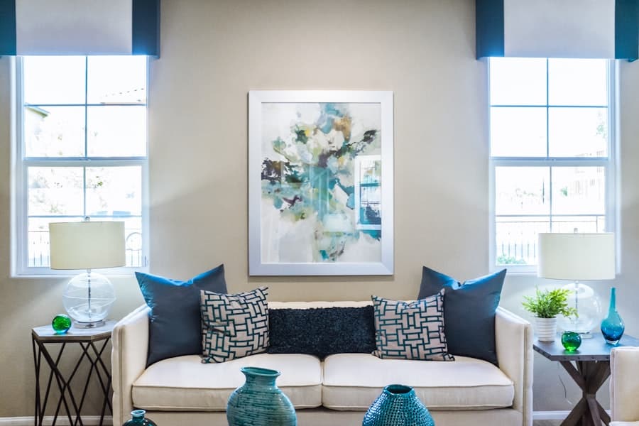Comfortable single room with seating and artwork